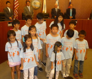 Coral Springs Chinese School students singing Taiwan ROC National Anthem to full house at Sunny Isles Beach sister city ceremony in Commissioners Chambers