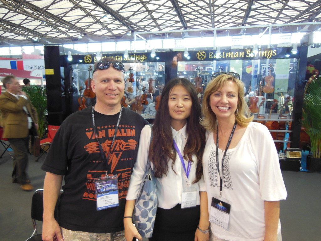 Every year Dan and Ricia attend the Music China Trade Show in Shanghai where they secure instruments for their northern Virginia business KBI Music Shoppe.  The experience, which came to them after adopting their daughter Olivia from China, has resulted in a growing business and new friendships, including one with their interpreter Yu (center).