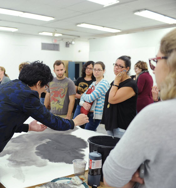 (Lan Zhenghui demonstrates his ink painting technique to students at Florida International University's College of Architecture + The Arts - photo by Alejandro Chavarria for World Red Eye)