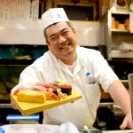 Sushi chef outside of Tsukiji Fish Market