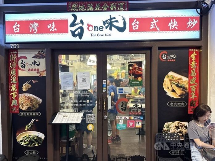 A customer waits for a table to open in Singapore's Tai One Wei Saturday