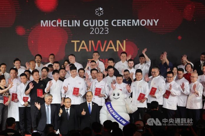 Representatives from restaurants picked by the Michelin Guide pose for a group photo at a ceremony held in Taipei
