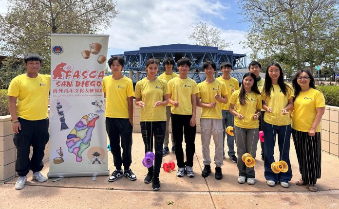 Group picture before the performance. Row 1 right 1 Consulting Mentor Marian Liu, left 1 Asst. Mentor Adam Wang; Row 2 left 1&2 Project Leader Elliot Chian, Evan Chen Diabolo at Chinese Academy Graduation